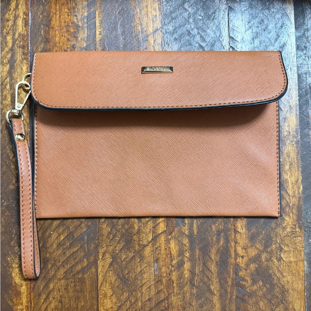 Tan leather clutch bag with gold hardware and magnetic closure
